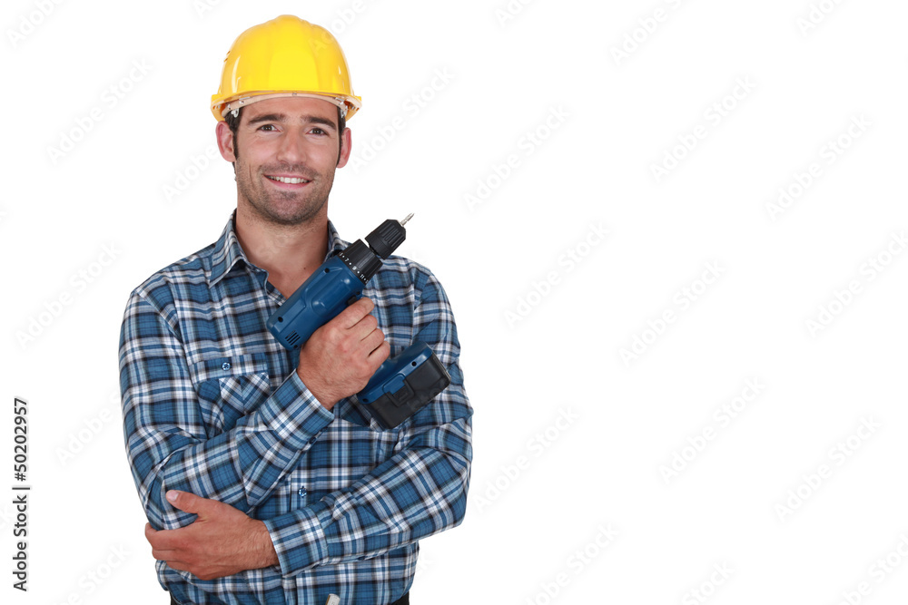 Worker holding cordless drill Worker holding cordless drill