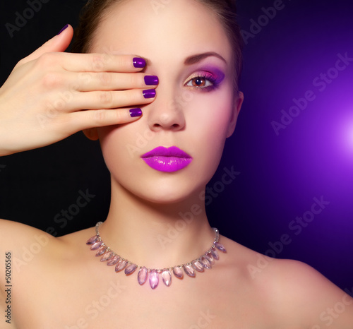 Makeup and manicure. black background