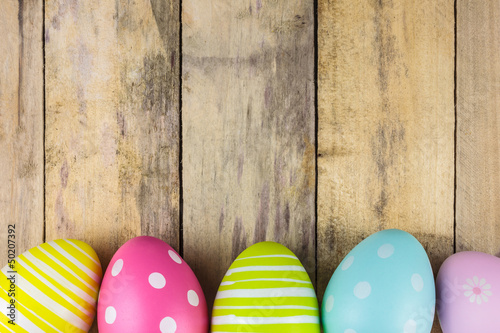 Dyed easter eggs on a wooden background