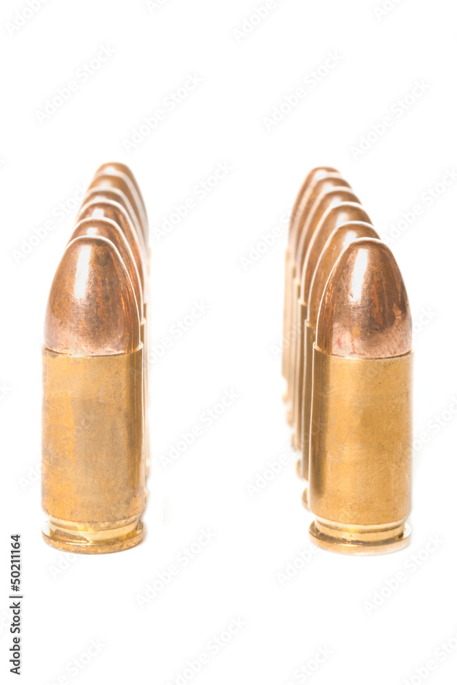 Two straight rows of scratched 9mm bullets Two straight rows of scratched 9mm bullets