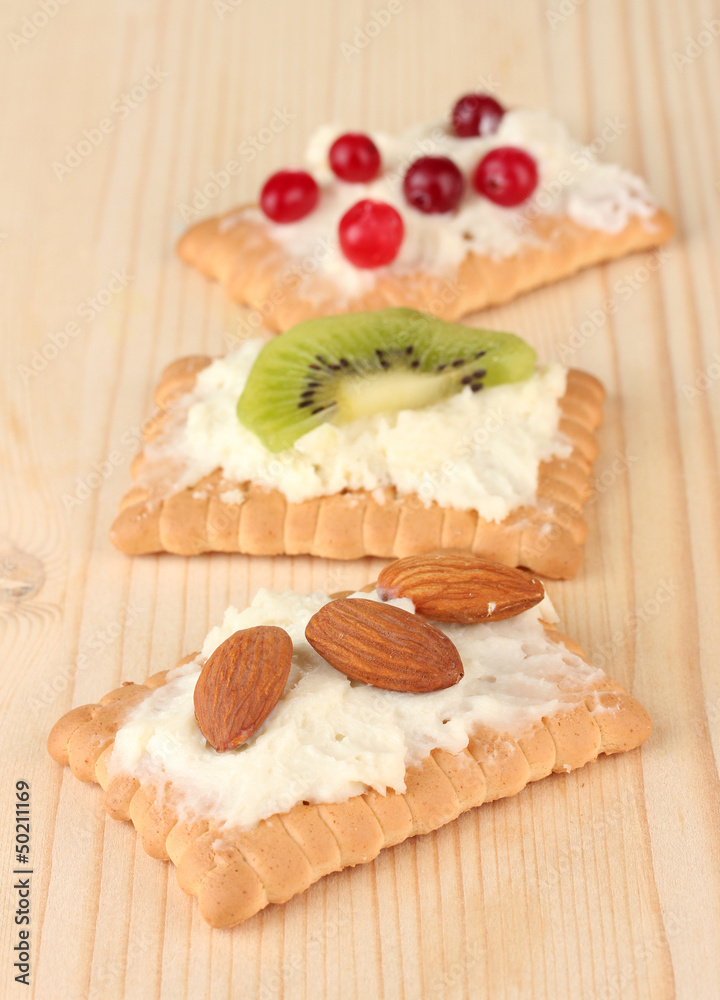 Tasty canapes with cheese, kiwi and cranberry, almond, Tasty canapes with cheese, kiwi and cranberry, almond,