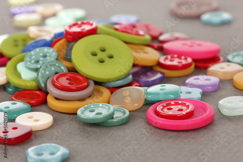 Buttons of different shapes, sizes and colors close-up