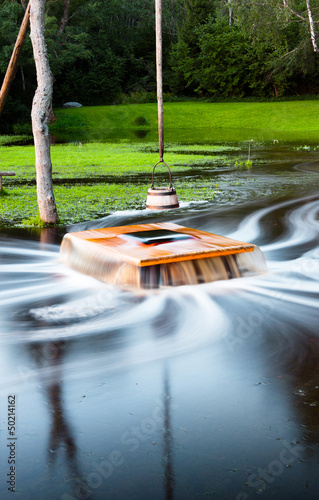 Flooding well Nõiakaev in Estonia photo