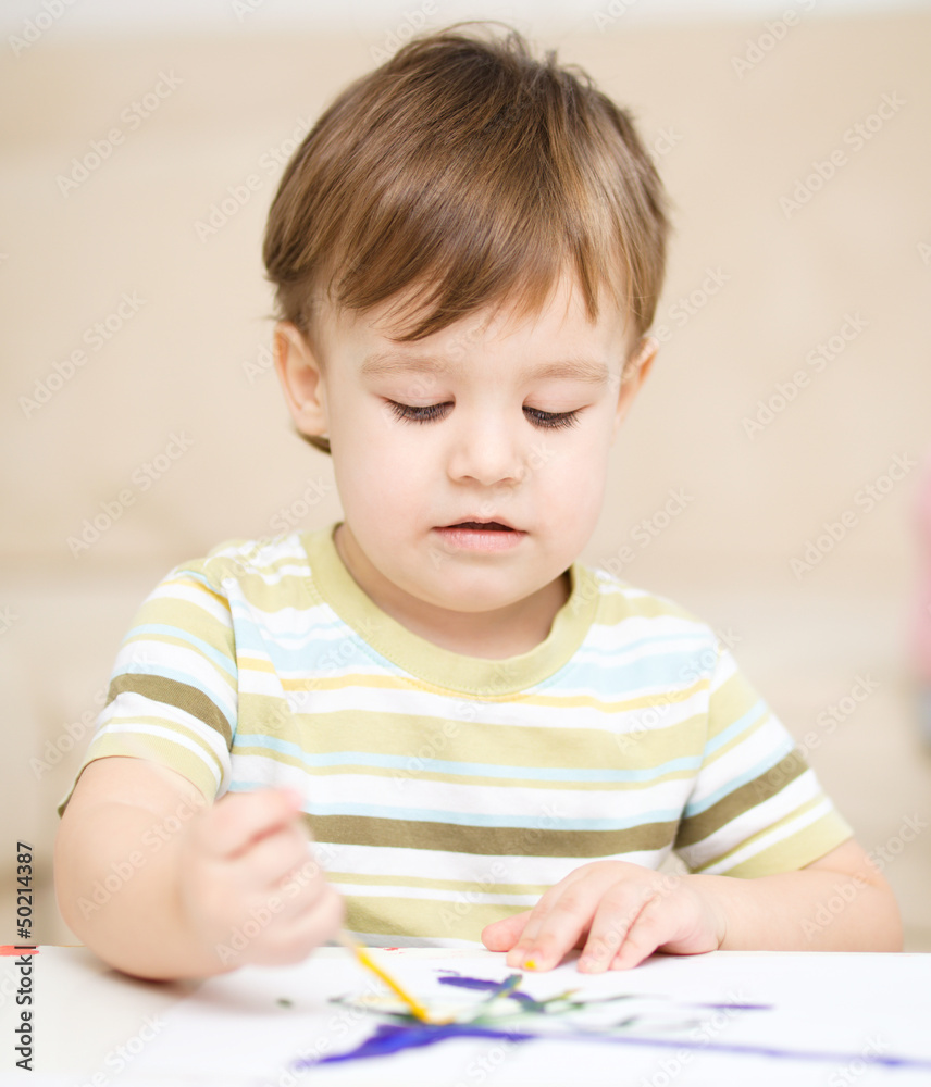 Little boy is playing with paints Little boy is playing with paints