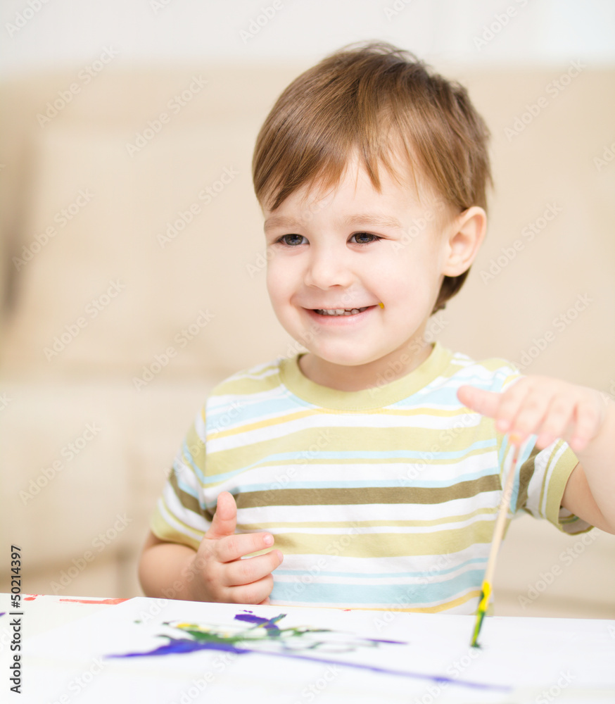 Little boy is playing with paints Little boy is playing with paints