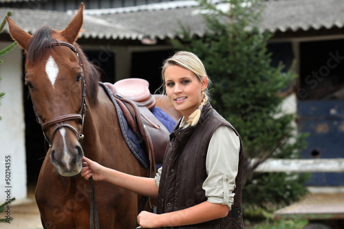 Fototapeta Naklejka Na Ścianę i Meble -  Blonde girl with horse
