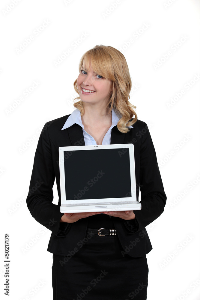 Blond woman presenting laptop Blond woman presenting laptop