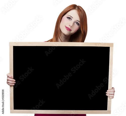Redhead student with blackboard.
