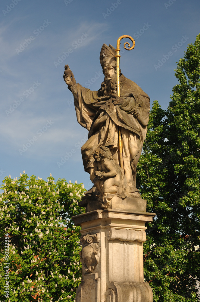 Obraz premium Saint Augustine statue holding, Charles Bridge Prague