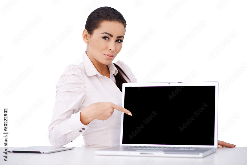Business woman sitting at her desk with laptop Business woman sitting at her desk with laptop