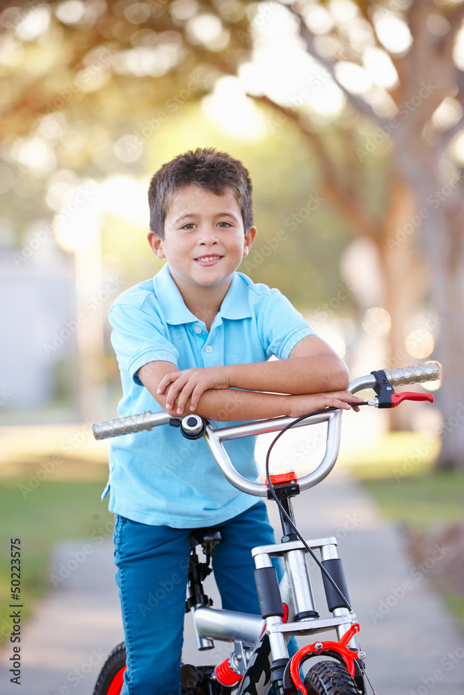 Obraz premium Boy Riding Bike On Path