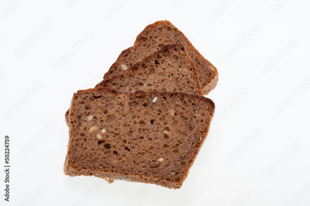 Slices of dark bread isolated over white Slices of dark bread isolated over white