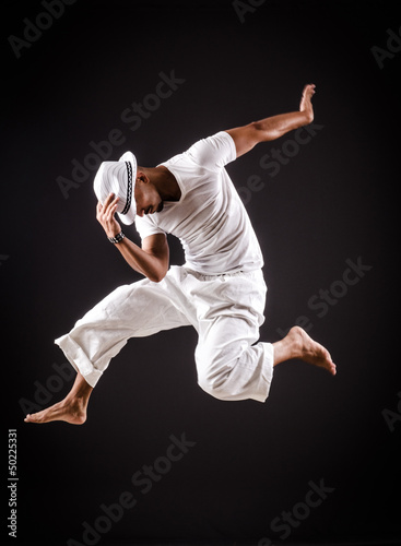 Dancer dancing dances in white clothing