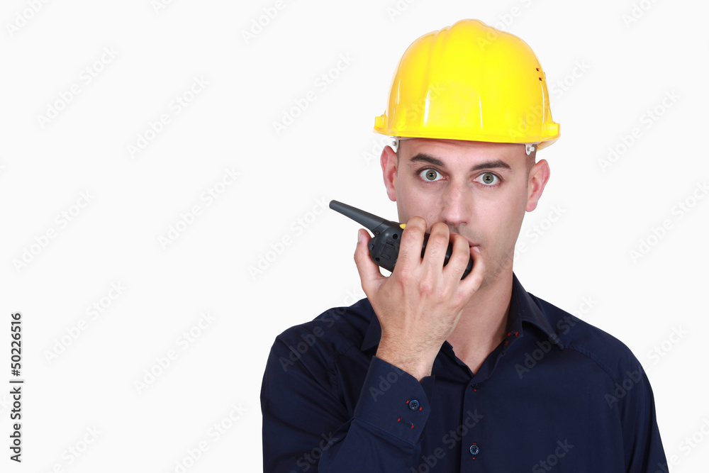 A foreman talking over the phone. A foreman talking over the phone.