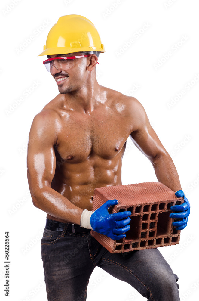 Muscular builder with bricks on white Muscular builder with bricks on white