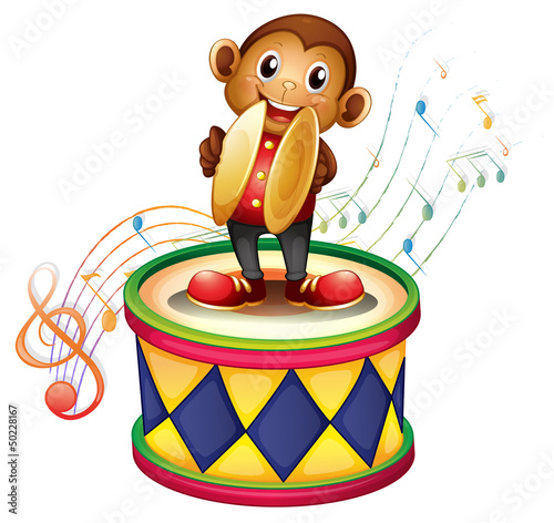 A monkey above a drum with cymbals