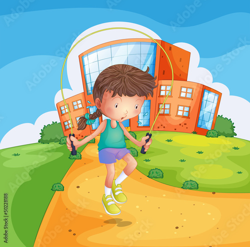 A young girl playing at the school ground