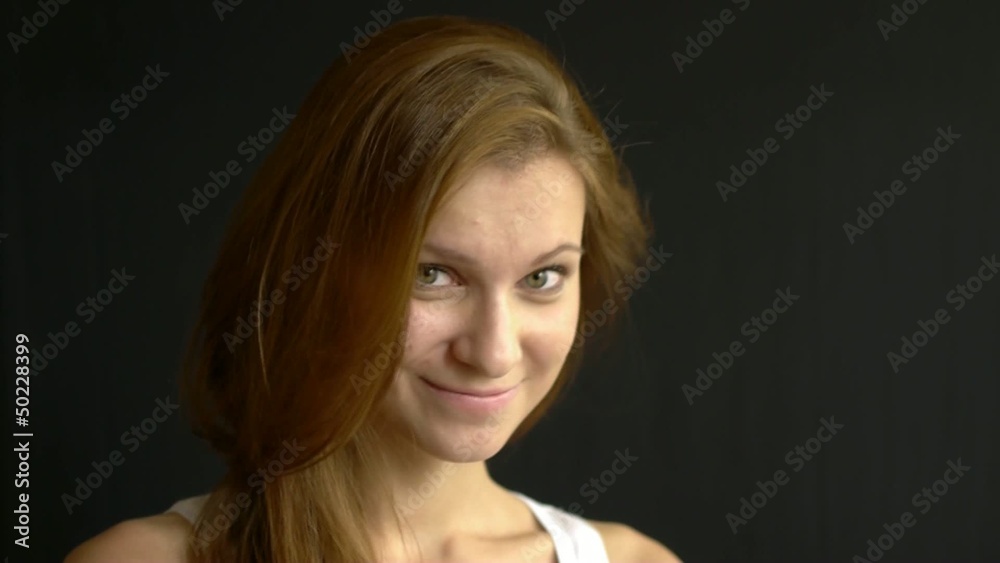 HD1080 Cute woman on black background looking at the camera.