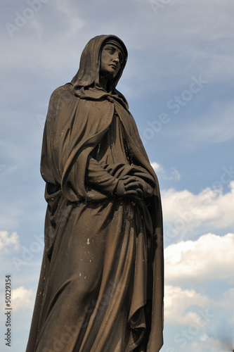 Detail cross on the Charles Bridge in Prague, Czech republic