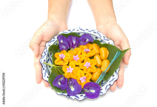 woman hand give  a lai thai dish of thai dessert photo