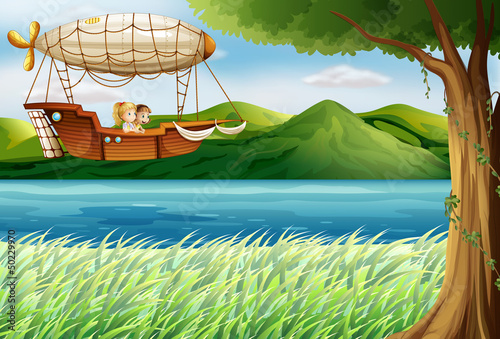 An airship near the river carrying two girls