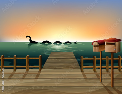 Sunset at the port with two wooden mailboxes