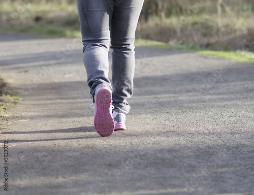 A woman is running in a park