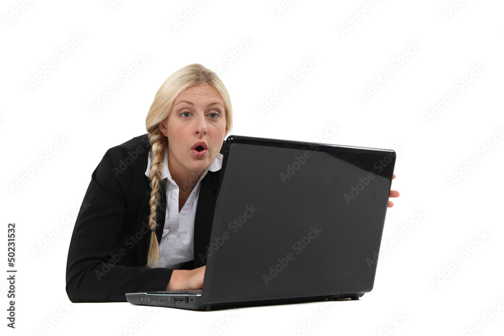 Woman surprised in front of a computer Woman surprised in front of a computer