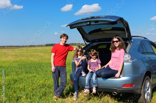Family car trip on vacation, happy parents travel with kids photo