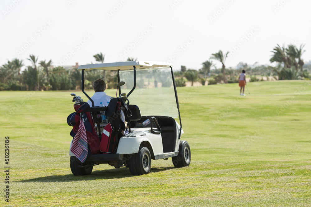 Electric golf buggy on a fairway