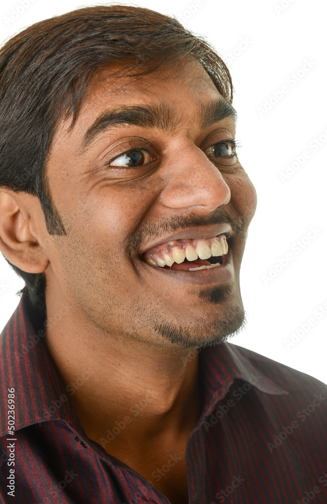 Smiling young Indian man, looking off camera - isolated on white Smiling young Indian man, looking off camera - isolated on white