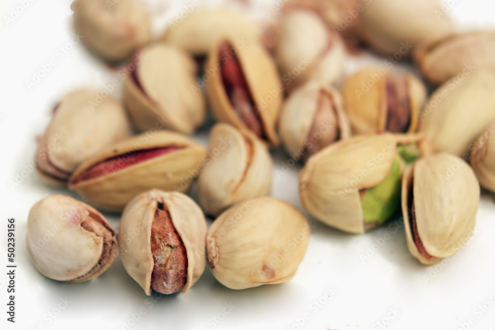 pistachios nuts on a light background