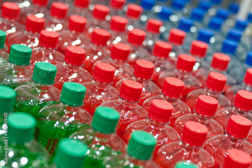 Image of many plastic bottles with water in a shop