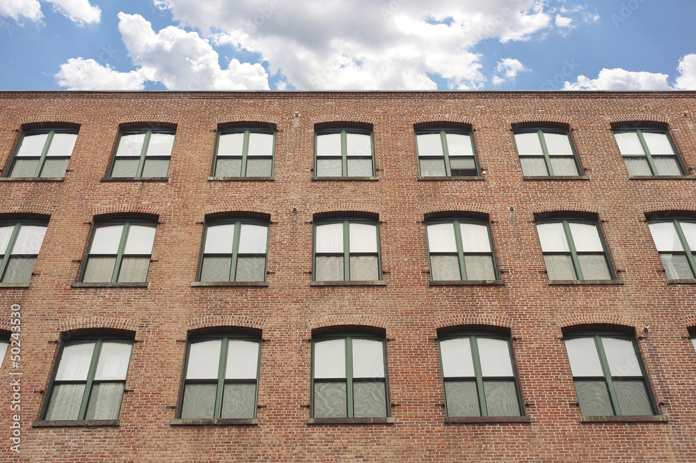 Facade of an old red brick apartment building in Brooklyn, NY Facade of an old red brick apartment building in Brooklyn, NY