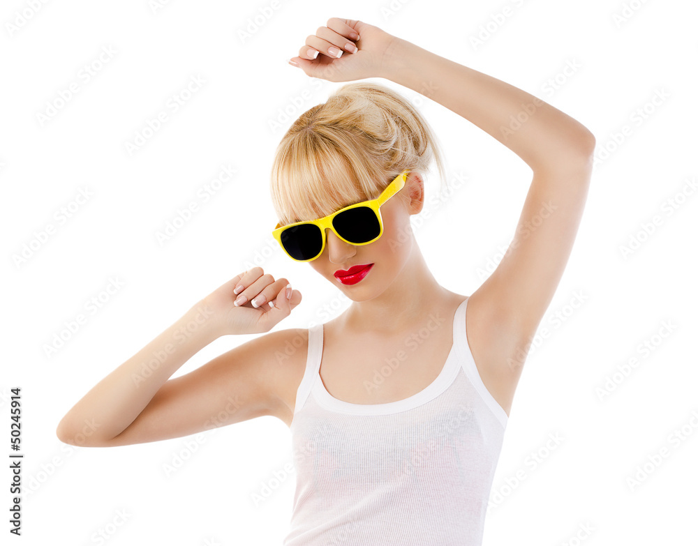 Young blonde woman dancing against white background Young blonde woman dancing against white background