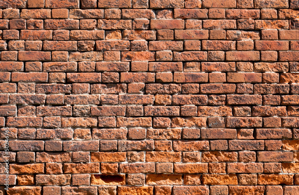 Obraz premium Old weathered red brick wall as background
