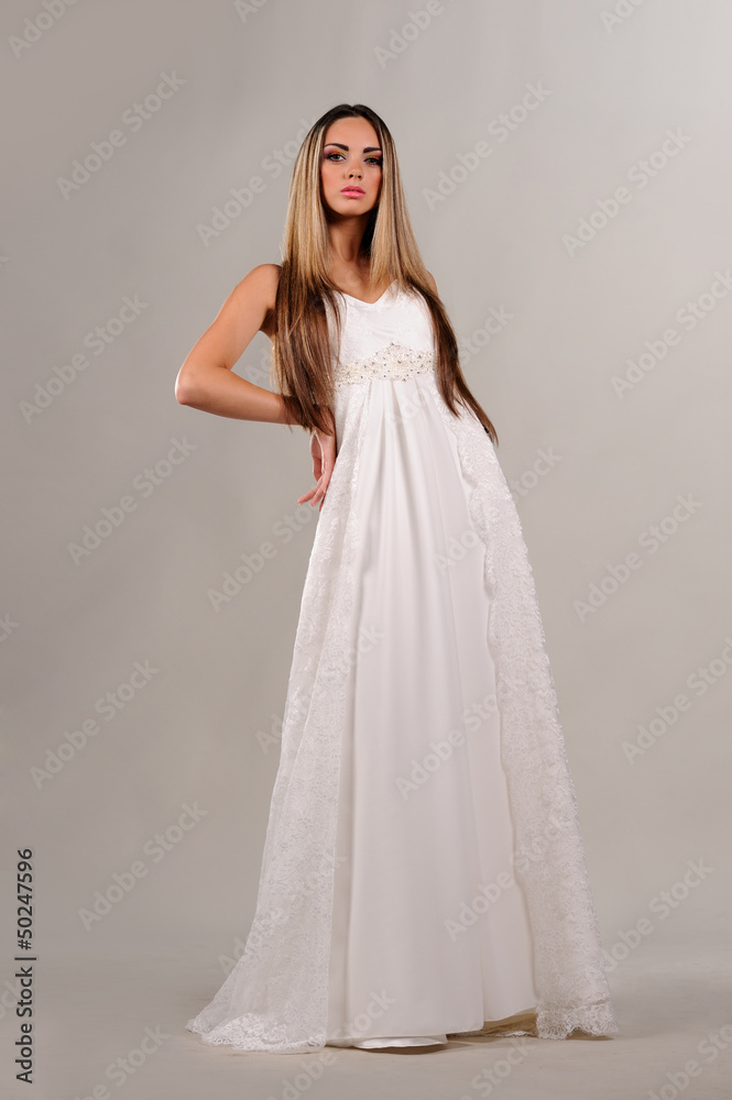 Beauty young bride dressed in elegance white wedding dress Beauty young bride dressed in elegance white wedding dress
