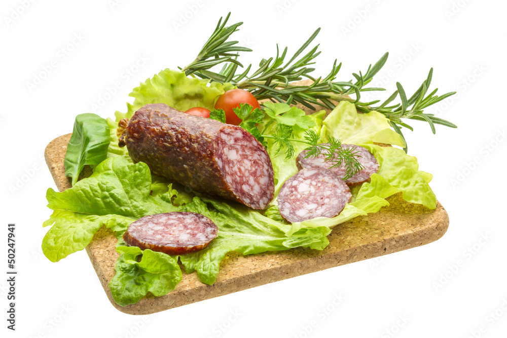 Salami with rosemary, salad and tomatoes Salami with rosemary, salad and tomatoes