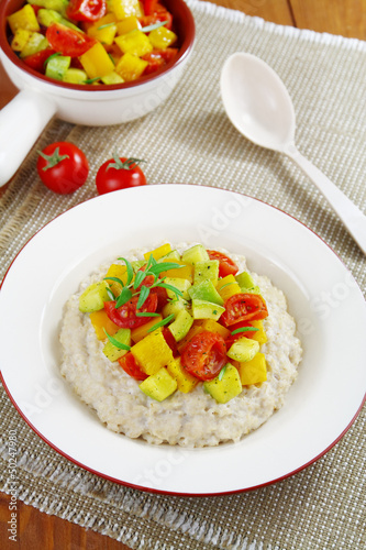 Oatmeal porridge with baked vegetables and rosemary