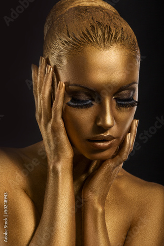 Face Art. Fantastic Gold Make Up. Stylized Colored Woman's Body