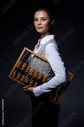 Accountant with old-fashioned adding machine