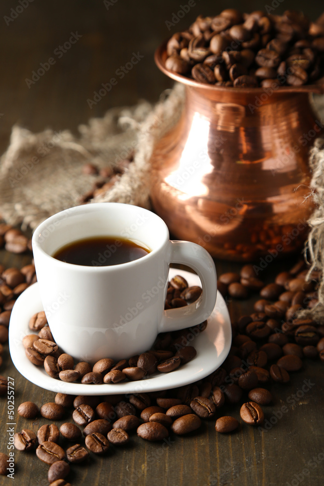 Cup of coffee and pot on wooden background Cup of coffee and pot on wooden background