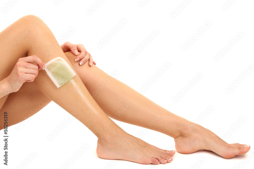 Beautiful woman doing depilation for her legs with waxing, Beautiful woman doing depilation for her legs with waxing,