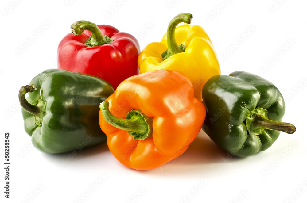 Five colorful peppers isolated over white