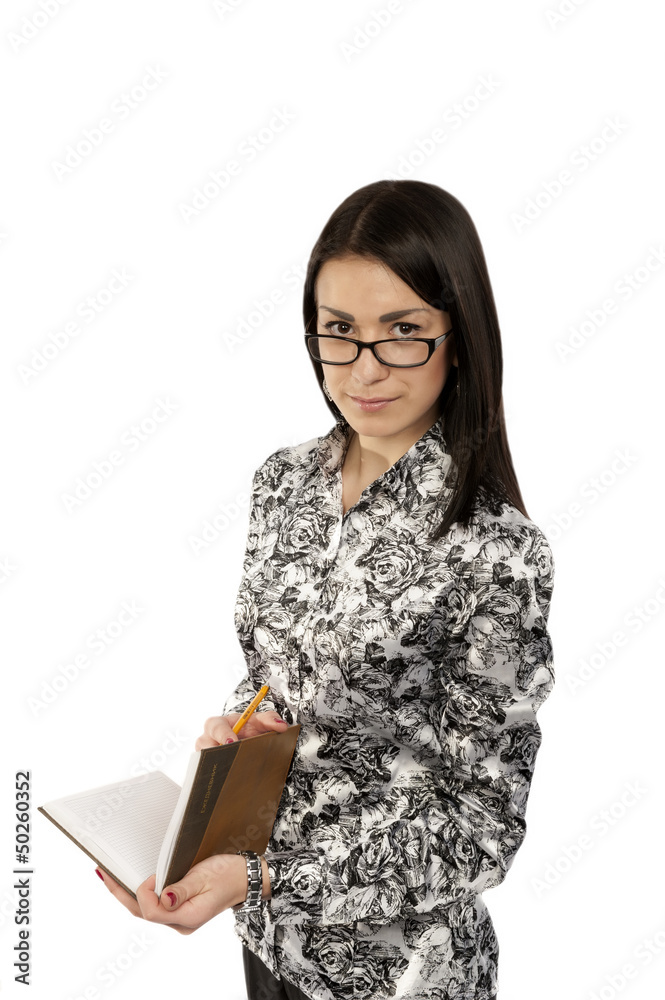 Young girl with a notebook and pencil