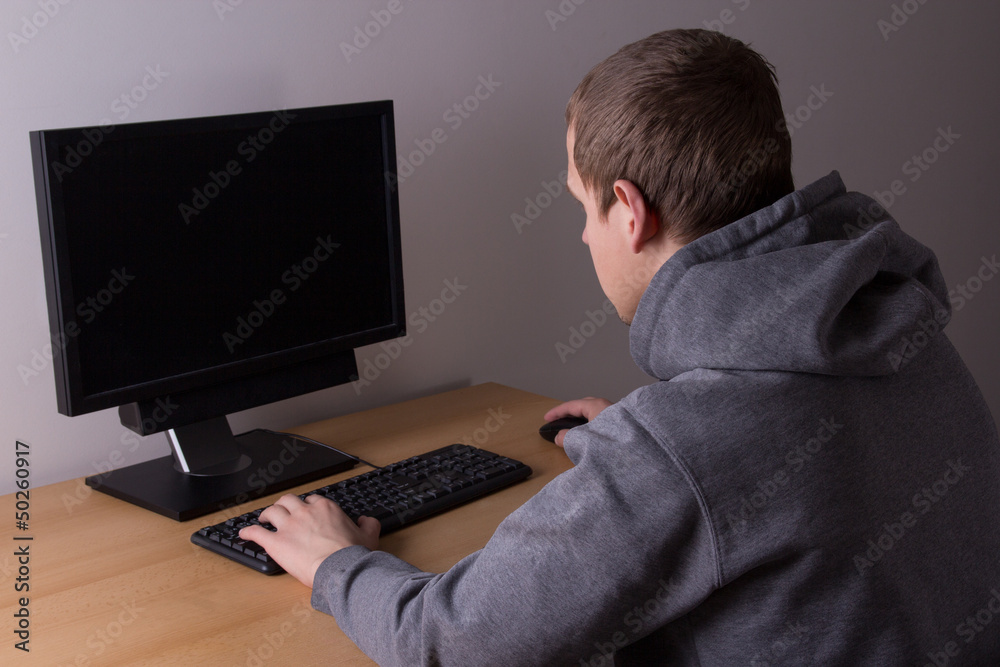 young man working with a computer young man working with a computer