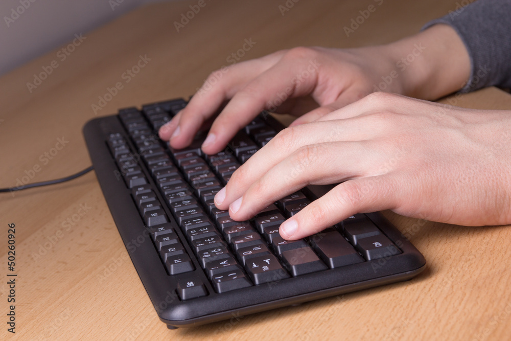 male hands working with keyboard male hands working with keyboard