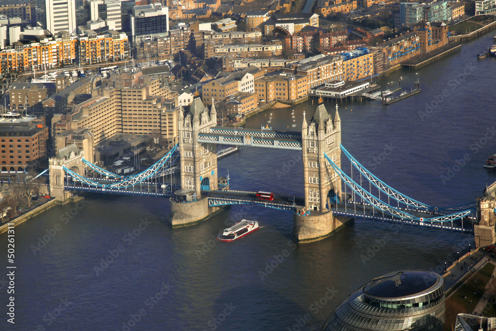 Tower Bridge with boat in London,  England