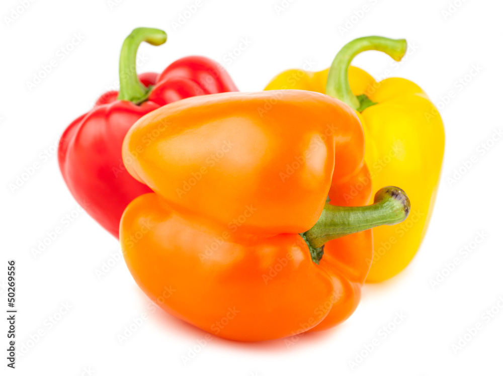 Three sweet red, orange, and yellow peppers Three sweet red, orange, and yellow peppers
