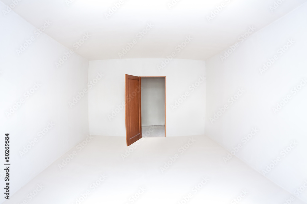 Opened door in the empty white room Opened door in the empty white room